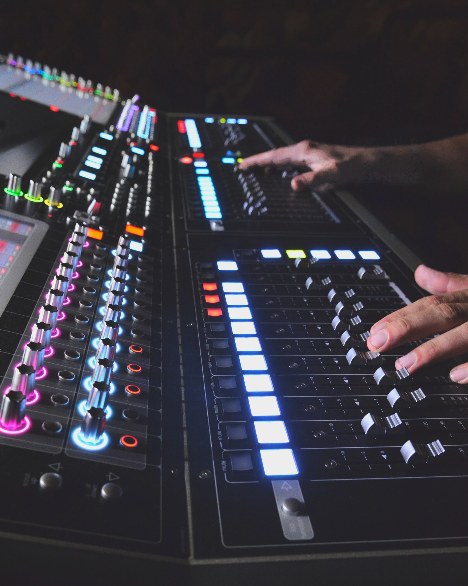 Master Sgt. Loren Zimmer, front of house sound engineer for the Concert Band and Singing Sergeants, adjusts the sliders on the mixing console during a performance at the St. Augustine Amphitheater on Monday, Oct. 20. (U.S. Air Force photo by Senior Master Sgt. Bob Kamholz/released)
