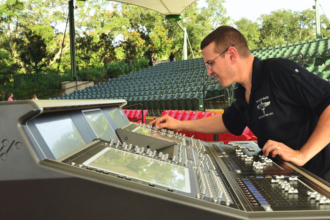 Master Sgt. Loren Zimmer, front of house sound engineer for the Concert Band and Singing Sergeants, makes some adjustments on the mixing console during the sound check prior to their performance at the St. Augustine Amphitheater on Monday, Oct. 20. (U.S. Air Force photo by Senior Master Sgt. Bob Kamholz/released)  
