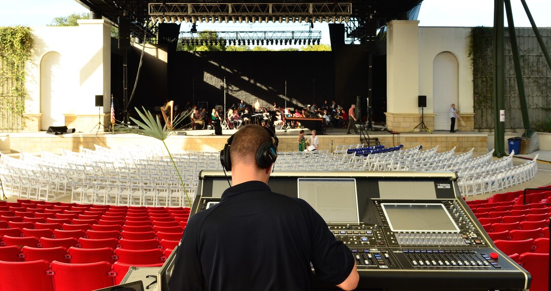 Master Sgt. Loren Zimmer, front of house sound engineer for the Concert Band and Singing Sergeants, makes some final adjustments just prior to sound check prior to their performance at the St. Augustine Amphitheater, on Monday, Oct. 20. (U.S. Air Force photo by Senior Master Sgt. Bob Kamholz/released)  
