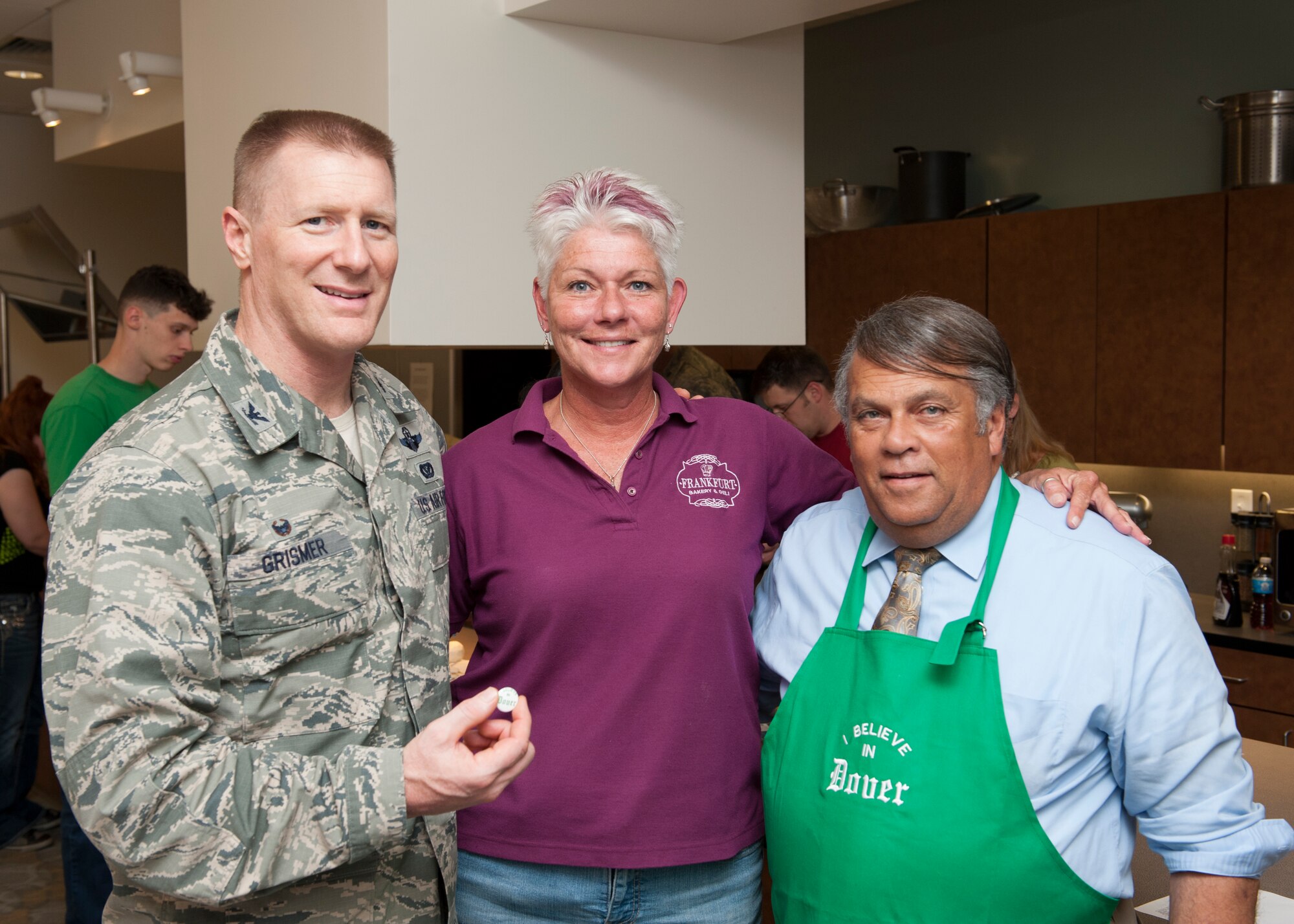 Col. Michael Grismer, 436th Airlift Wing commander, Dawne Nickerson-Banez, 436th Logistics Readiness Squadron honorary commander, and Dover Mayor Robin Christiansen pose for a photo during a “Dorm to Gourm” Leadership Pathways Professional Development course Oct. 28, 2014, at the fitness center on Dover Air Force Base, Del. The monthly course has been organized by Nickerson-Banez since last April. (U.S. Air Force photo/Airman 1st Class Zachary Cacicia) 
