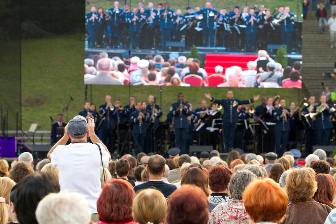 Recently the USAFE band performed in various locations in Slovakia to celebrate the 70th anniversary of  the Slovak National Uprising.  Lt. Colonel Mike Mench conducts the band at the "Day of National Uprising" Celebration Event in the city of Banska Bystrica. (U.S. Air Force photo by Technical Sergeant Nick Wellman/Released)