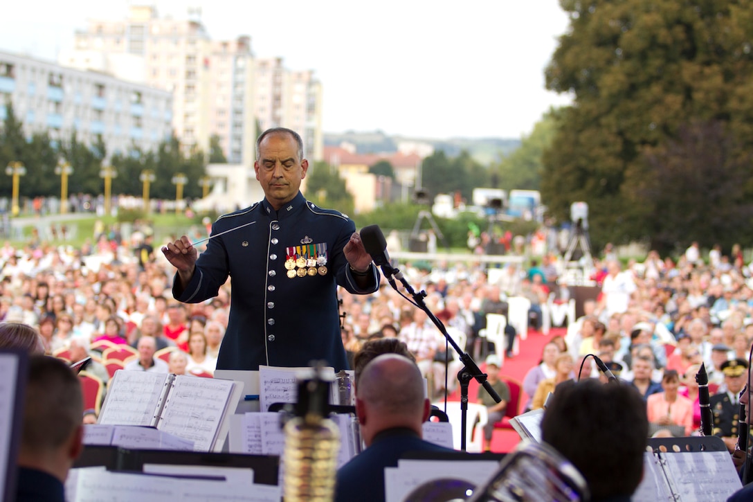 Recently the USAFE band performed in various locations in Slovakia to celebrate the 70th anniversary of  the Slovak National Uprising.  Lt. Colonel Mike Mench conducts the band at the "Day of National Uprising" Celebration Event in the city of Banska Bystrica. (U.S. Air Force photo by Technical Sergeant Nick Wellman/Released)