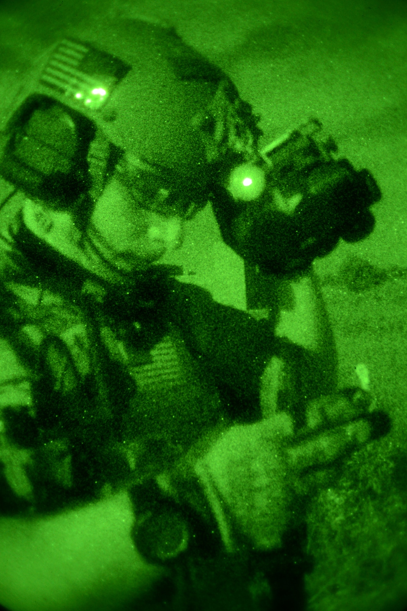 A U.S. Air Force Air Commando reads a map Oct. 9, 2014, during a training mission at Stanford Training Area near Thetford, England. Air Commandos searched for simulated potential threats and rescued simulated hostages in the training area. (U.S. Air Force photo by Airman 1st Class Kyla Gifford/Released)