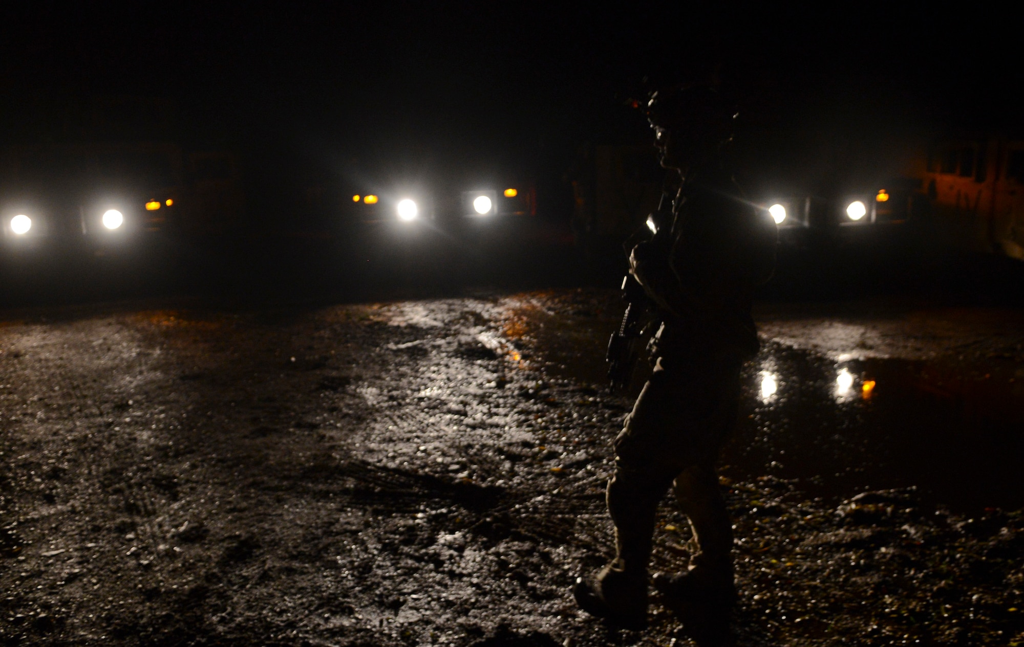 A U.S. Air Force Air Commando stands guard Oct. 9, 2014, during a training mission at Stanford Training Area near Thetford, England. Once the training mission was complete, the convoy traveled to the rally point to take accountability. (U.S. Air Force photo by Staff Sgt. Micaiah Anthony/Released)