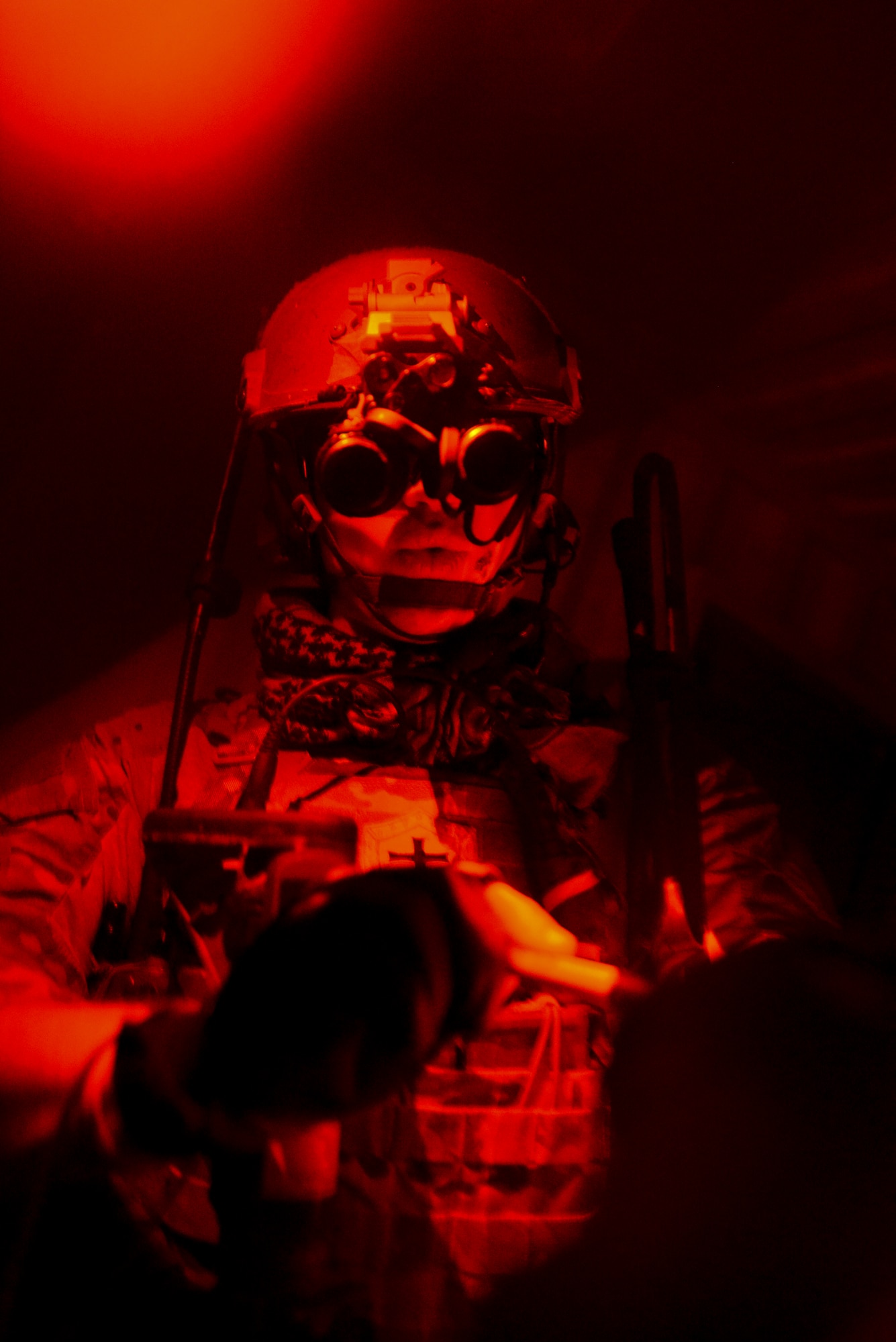 A U.S. Air Force Air Commando checks a map Oct. 9, 2014, during a training mission at Stanford Training Area near Thetford, England. During the training mission, Air Commandos searched for simulated potential threats and rescued simulated hostages in the training area. (U.S. Air Force photo by Staff Sgt. Micaiah Anthony/Released)