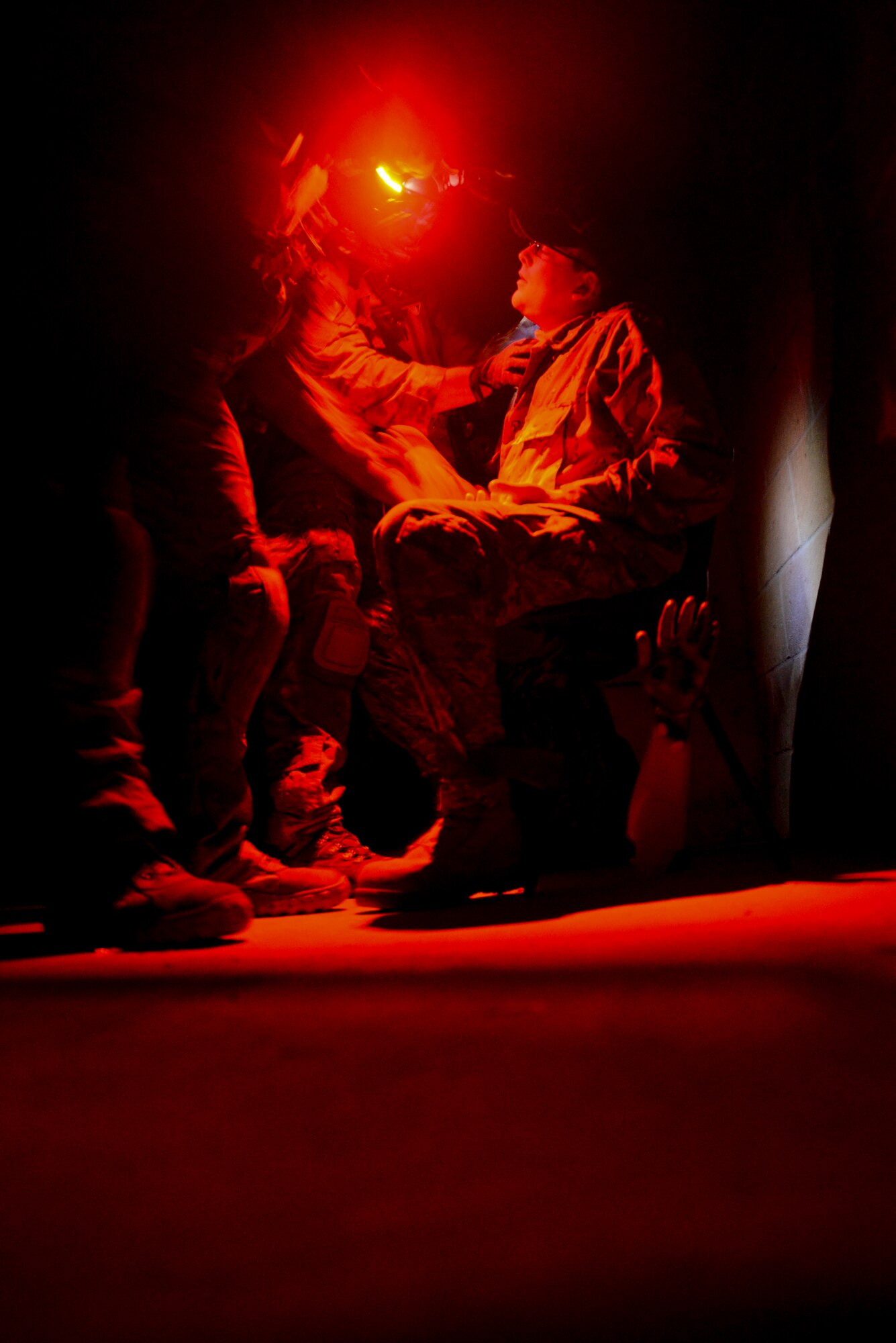 U.S. Air Force Air Commandos check a simulated patient’s vital signs Oct. 9, 2014, during a training mission at Stanford Training Area near Thetford, England. The purpose of the training was to give Air Commandos the opportunity to hone their skills. (U.S. Air Force photo by Staff Sgt. Micaiah Anthony/Released)