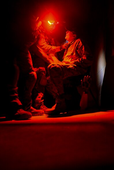 U.S. Air Force Air Commandos check a simulated patient’s vital signs Oct. 9, 2014, during a training mission at Stanford Training Area near Thetford, England. The purpose of the training was to give Air Commandos the opportunity to hone their skills. (U.S. Air Force photo by Staff Sgt. Micaiah Anthony/Released)