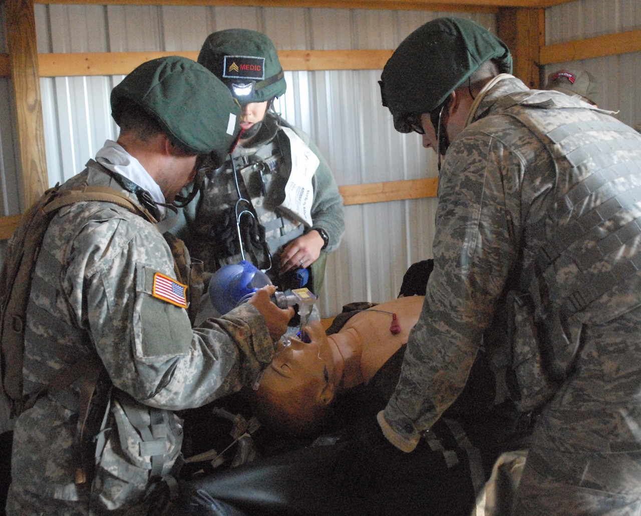Fourth-year medical students work on a simulated patient presumed to be suffering from diabetic ketoacidosis, when the body has no insulin, as part of Operation Bushmaster, a field training exercise conducted at Fort Indiantown Gap, Pa. DoD photo by Sarah Marshall