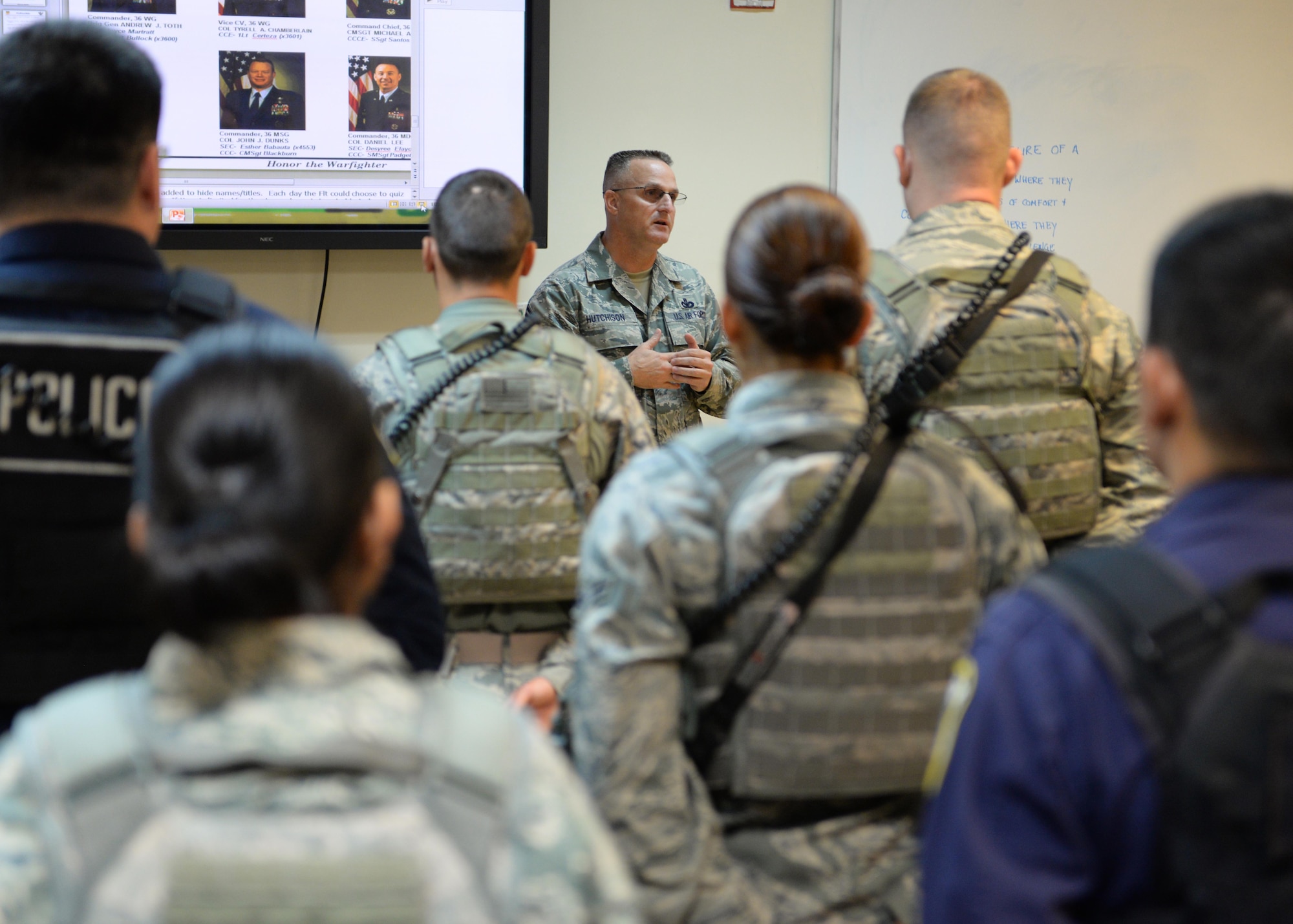 Chief Master Sgt. Harold Hutchison, Pacific Air Forces command chief master sergeant, briefs at a 36th Security Forces Squadron guard mount Oct. 20, 2014, on Andersen Air Force Base, Guam. Hutchison visited with Team Andersen Airmen for the first time since assuming his position as the command’s senior enlisted leader. (U.S. Air Force photo by Senior Airman Katrina M. Brisbin/Released)