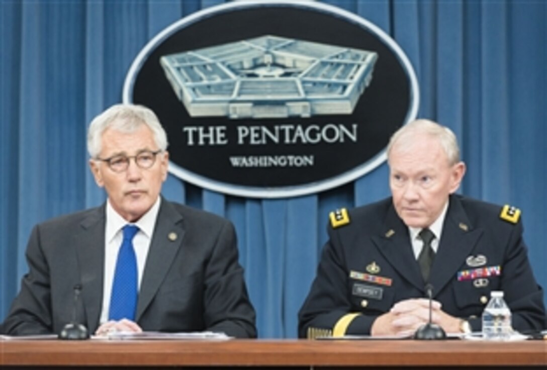 Defense Secretary Chuck Hagel holds a press briefing with Army Gen. Martin E. Dempsey, chairman of the Joint Chiefs of Staff at the Pentagon, Oct. 30, 2014. 