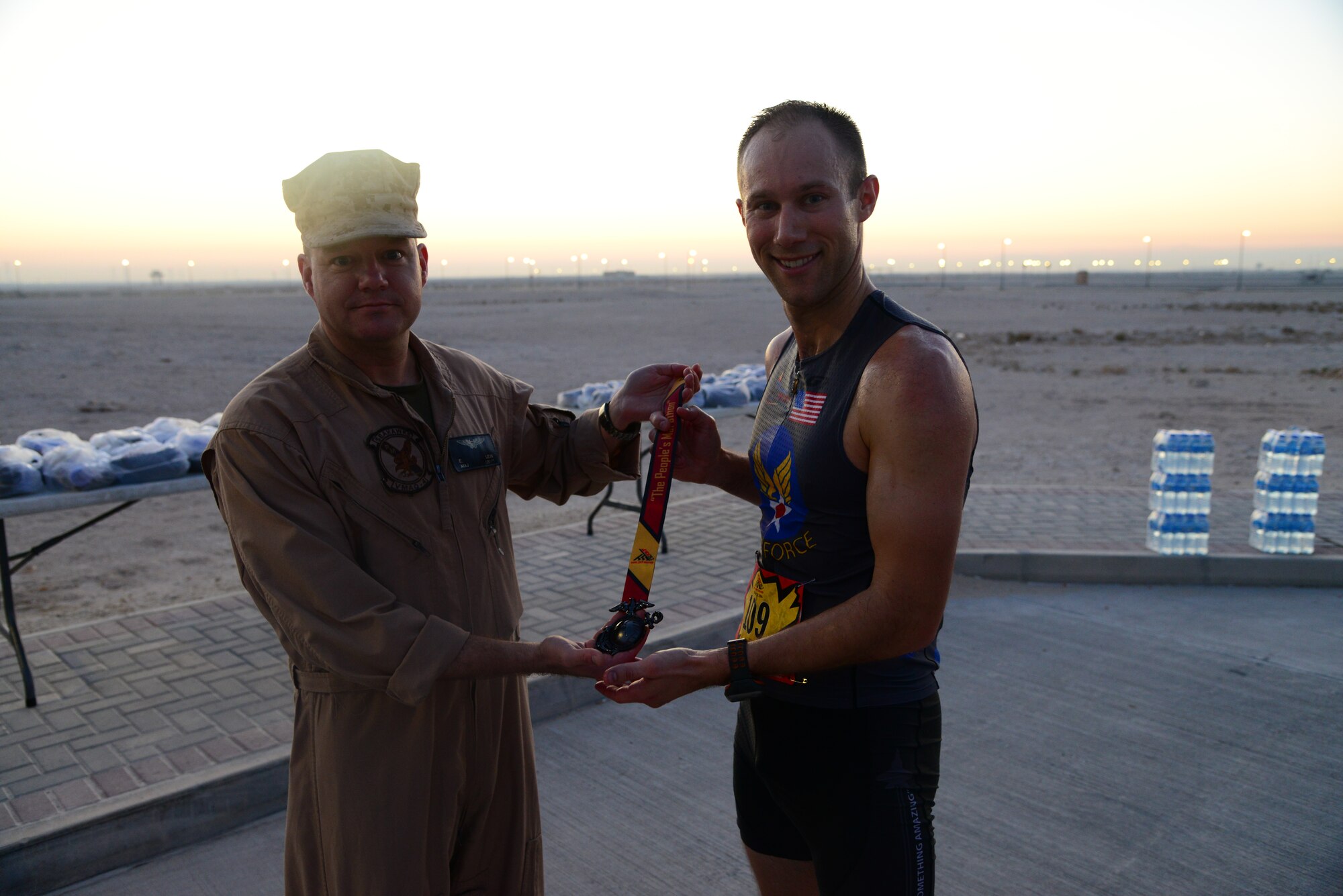 Air Force Maj. Brian Hans, from the Combined Air Operations Center, at Al Udeid Air Base, Qatar, took second place during the Marine Corps Marathon-Forward, October 26. Hans' run time was three hours and sixteen minutes. Air Force 2nd Lt. Sarah Auer, from the 379th Expeditionary Civil Engineer Squadron, here, took first place with a run time of 3:08 (U.S. Air Force photo by Staff Sgt. Ciara Wymbs)