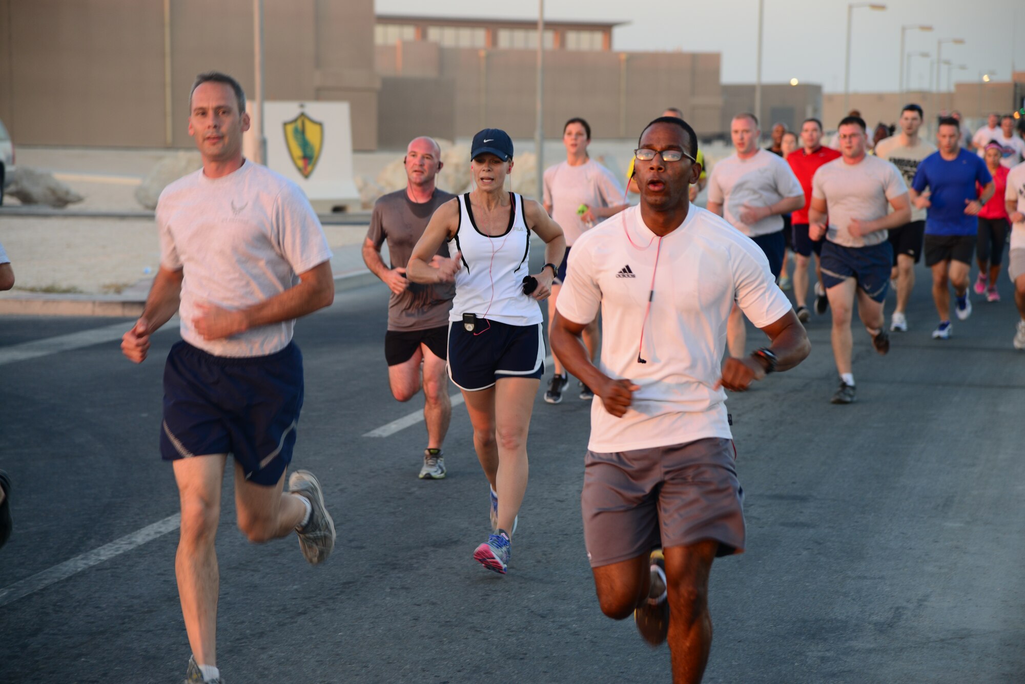 Grand Slam servicemembers, deployed to Al Udeid Air Base, Qatar, did a warrior run, October 25, in honor of two fallen comrades, who died while supporting Operation Enduring Freedom.  The servicemembers honored are Major Michael Donahue and Sergeant First Class Matthew Leggett, who were assigned to the 18th Airborne Corps at Fort Bragg, S.C. (U.S. Air Force photo by Staff Sgt. Ciara Wymbs) 