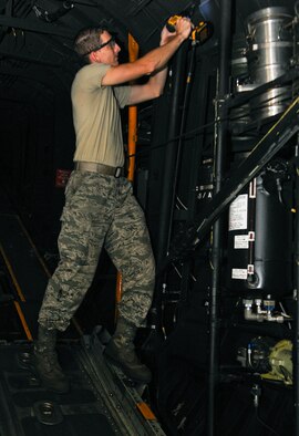 Staff Sgt. Jason Mayfield, 1st Special Operations Equipment Maintenance Squadron aircraft structural maintenance lead technician, selects tools to be used on sheet metal at Hurlburt Field, Fla., Oct. 29, 2014. Mayfield creates patches to repair MC-130P Combat Shadow. (U.S. Air Force photo/Airman 1st Class Andrea Posey)