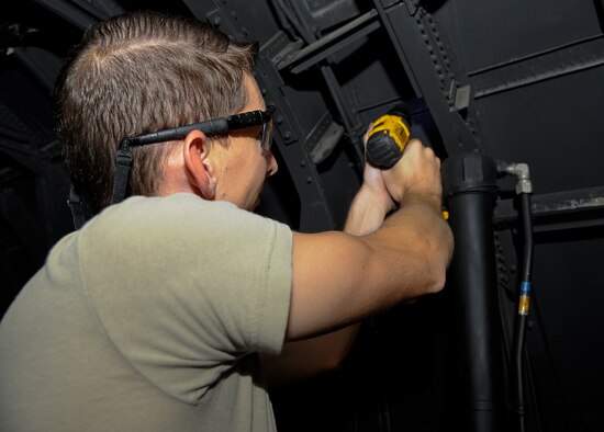 Staff Sgt. Robert McLendon, 1st Special Operations Equipment Maintenance Squadron aircraft structural maintainer, fixes a new stringer an MC-130P Combat Shadow on Hurlburt Field, Fla., Oct. 29, 2014. Aircraft structural Airmen repair damages, replace parts and inspect the structure of an aircraft 24 hours a day to keep the mission going. U.S. Air Force photo/Airman 1st Class Andrea Posey)