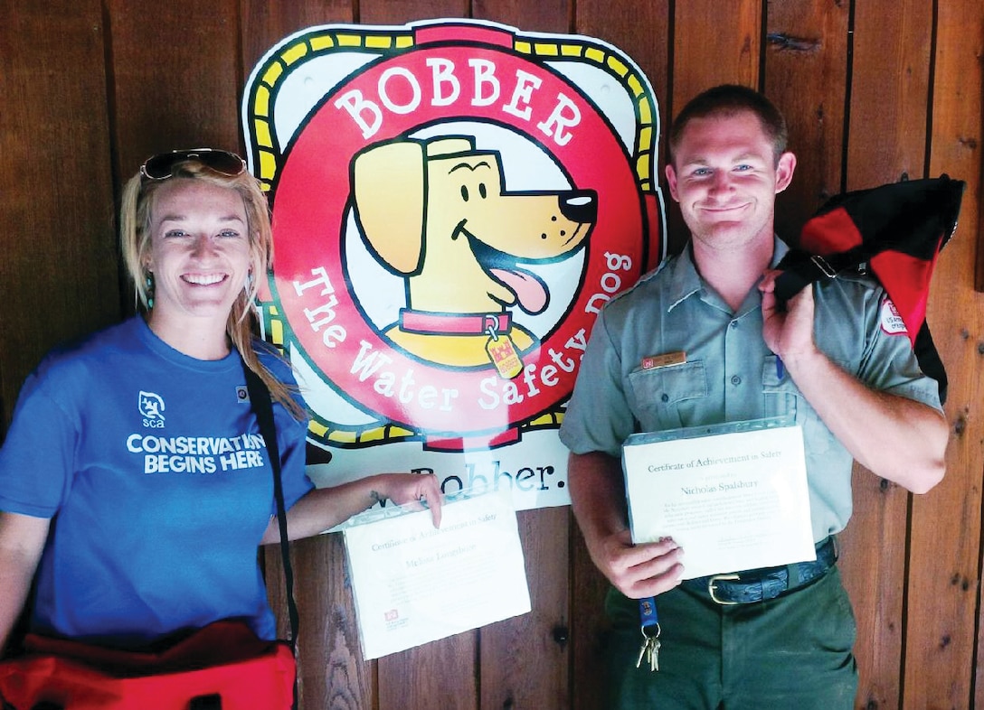 Alum Creek Lake employees Melissa Longshore, SCA intern (left), and Nicholas Spalsbury, Water Safety Ranger, each received employee safety awards for their contributions to water and boating safety programs during the 2014 recreation season. Over 15,000 direct contacts have been made through education programs, fair and event exhibits, parades, and visitor assistance patrols.
(Photo by Robert J. Wattenschaidt)
