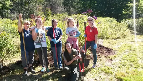 A Connecticut Girl Scout Troop assists Park Ranger Marissa Wright in improving the Black Rock Lake butterfly garde during the National Public Lands Day Event, Sept. 14, 2014.