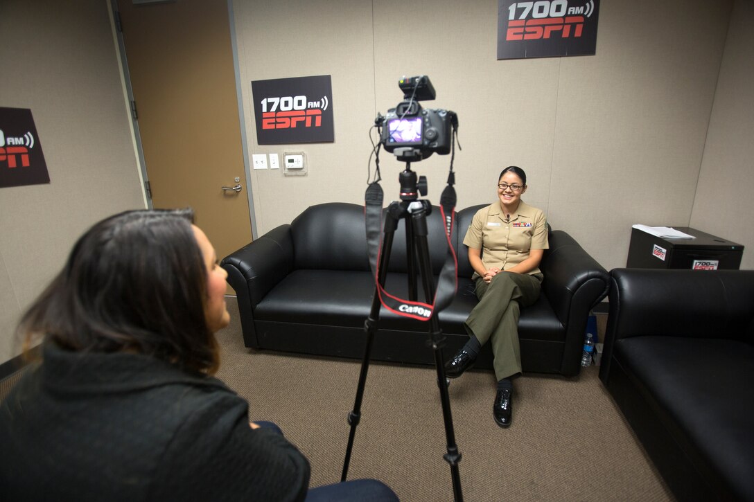 Cpl. Josephina Garza, pay chief with 12th Marine Corps District is
interviewed for a Military Salute segment on FM 105.7 MAX and AM 1090 Sports
radio in their studio at Broadcast Company of the Americas San Diego, Oct.
30, 2014. Cpl Garza was selected for the interview after winning the
meritorious sergeant promotion board for the Western Recruiting Region.
(Official U.S. Marine Corps photo by Sgt. Rebecca Eller/Released)
