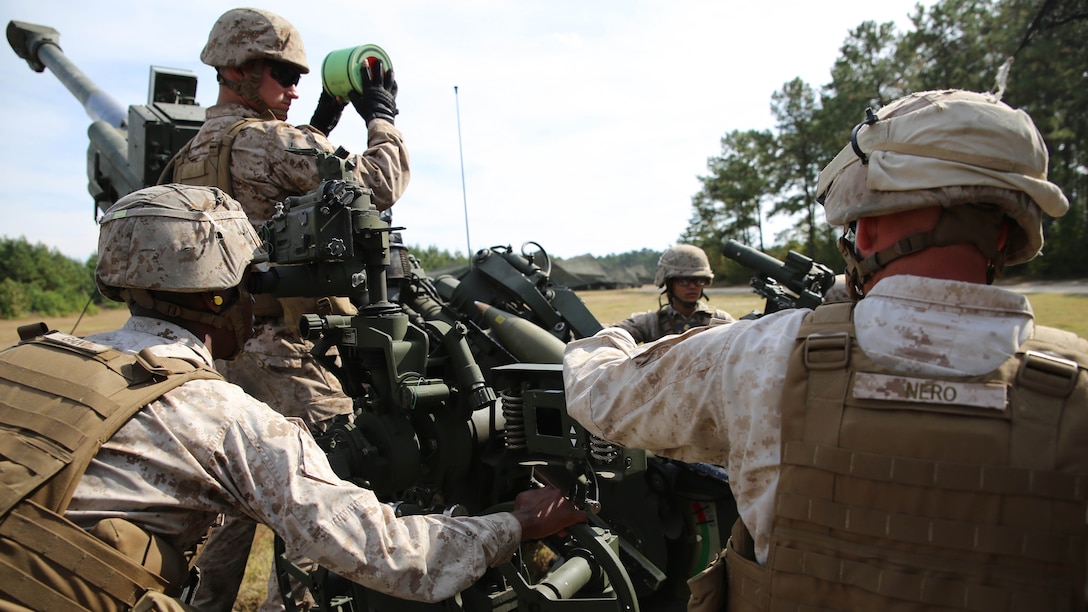 Artillery Marines with Gun 3, Battery A, Ground Combat Element Integrated Task Force, prepare to send a round down range during a fire mission at Marine Corps Base Camp Lejeune, Oct. 29, 2014. Marines of Battery A conducted a live-fire artillery shoot, Oct. 28-30, 2014. From October 2014 to July 2015, the GCEITF will conduct individual and collective level skills training in designated ground combat arms occupational specialties in order to facilitate the standards based assessment of the physical performance of Marines in a simulated operating environment performing specific ground combat arms tasks. 