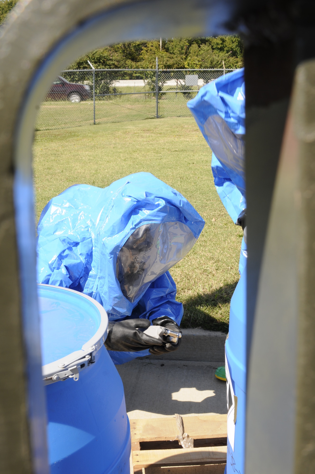 Emergency management specialists with the 188th Civil Engineering Squadron work to identify and clean up hazardous material spills during a training  exercise at Ebbing Air National Guard Base, Fort Smith, Ark., Oct. 4. (U.S. Air National Guard photo by Staff Sgt. Hannah Landeros/released)