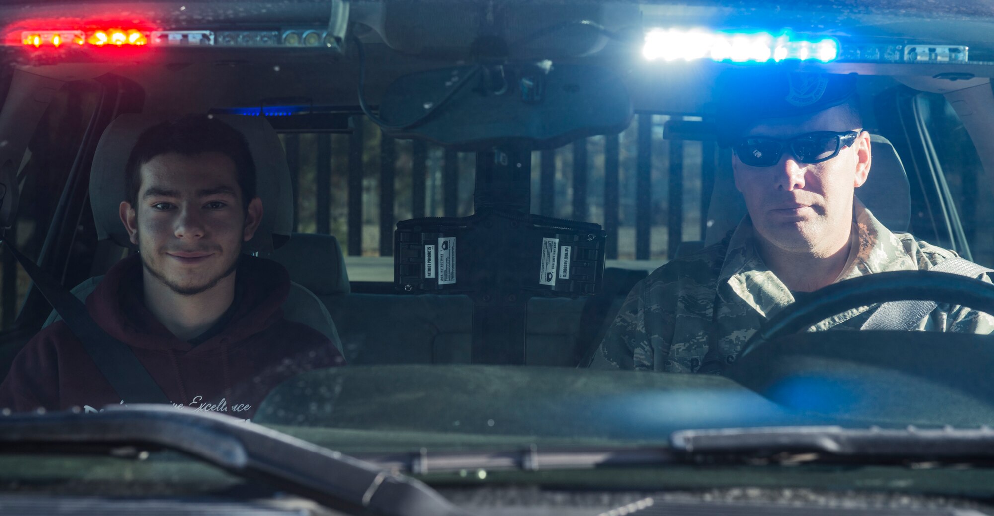 Therin Ortega, Richard McKenna Charter High School student, participates in a ride along with Master Sgt. Eric Parks, 366th Security Forces Squadron Flight Chief at Mountain Home Air Force Base, Idaho, Oct. 30, 2014. Ortega was able to participate in an exercise in which 366th SFS members apprehended a mock suspect who breached the perimeter of base. (U.S. Air Force photo by Airman Connor J. Marth/RELEASED)  