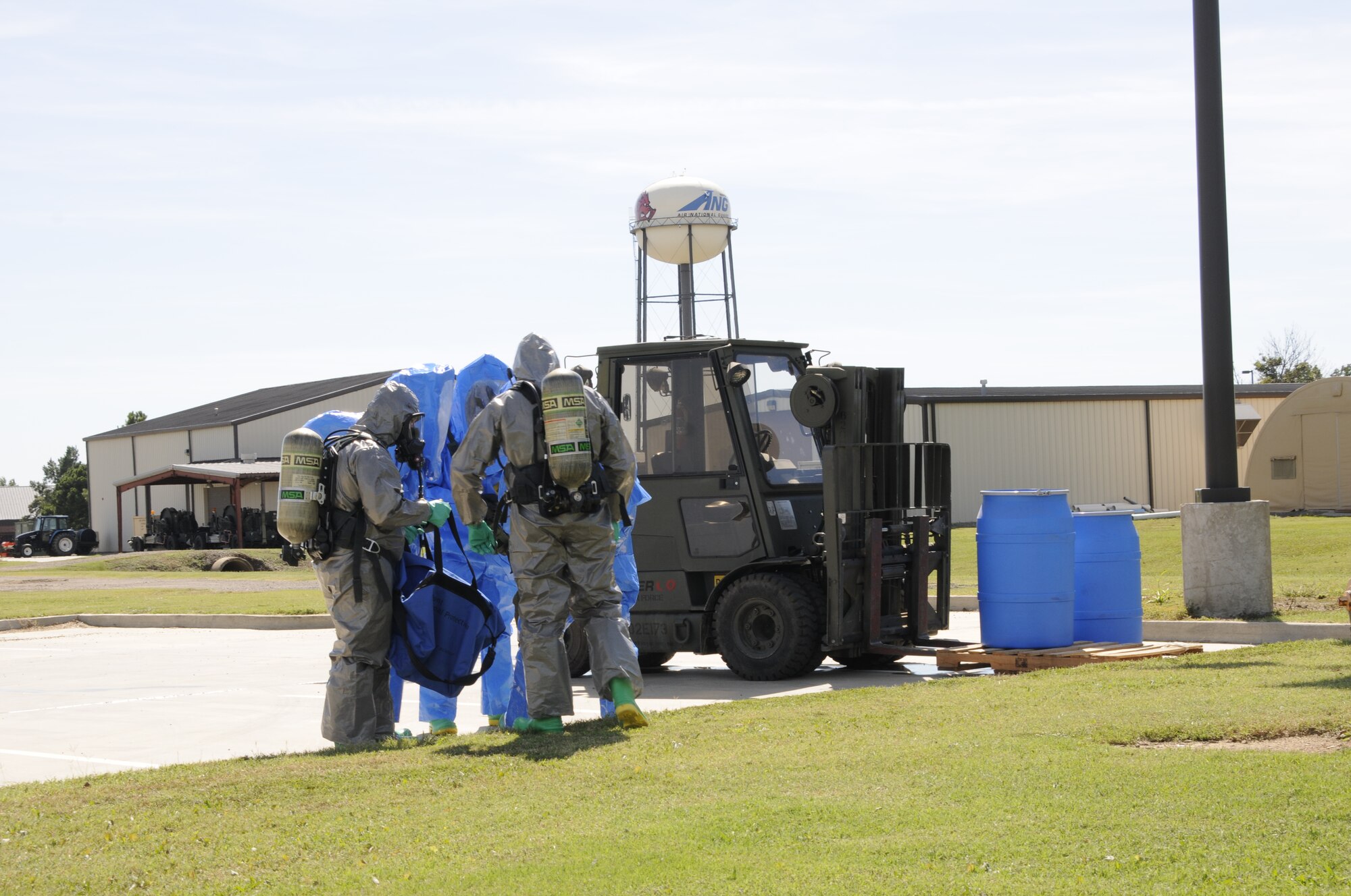 Emergency management specialists with the 188th Civil Engineering Squadron work to identify and clean up hazardous material spills during a training  exercise at Ebbing Air National Guard Base, Fort Smith, Ark., Oct. 4. (U.S. Air National Guard photo by Staff Sgt. Hannah Landeros/released)