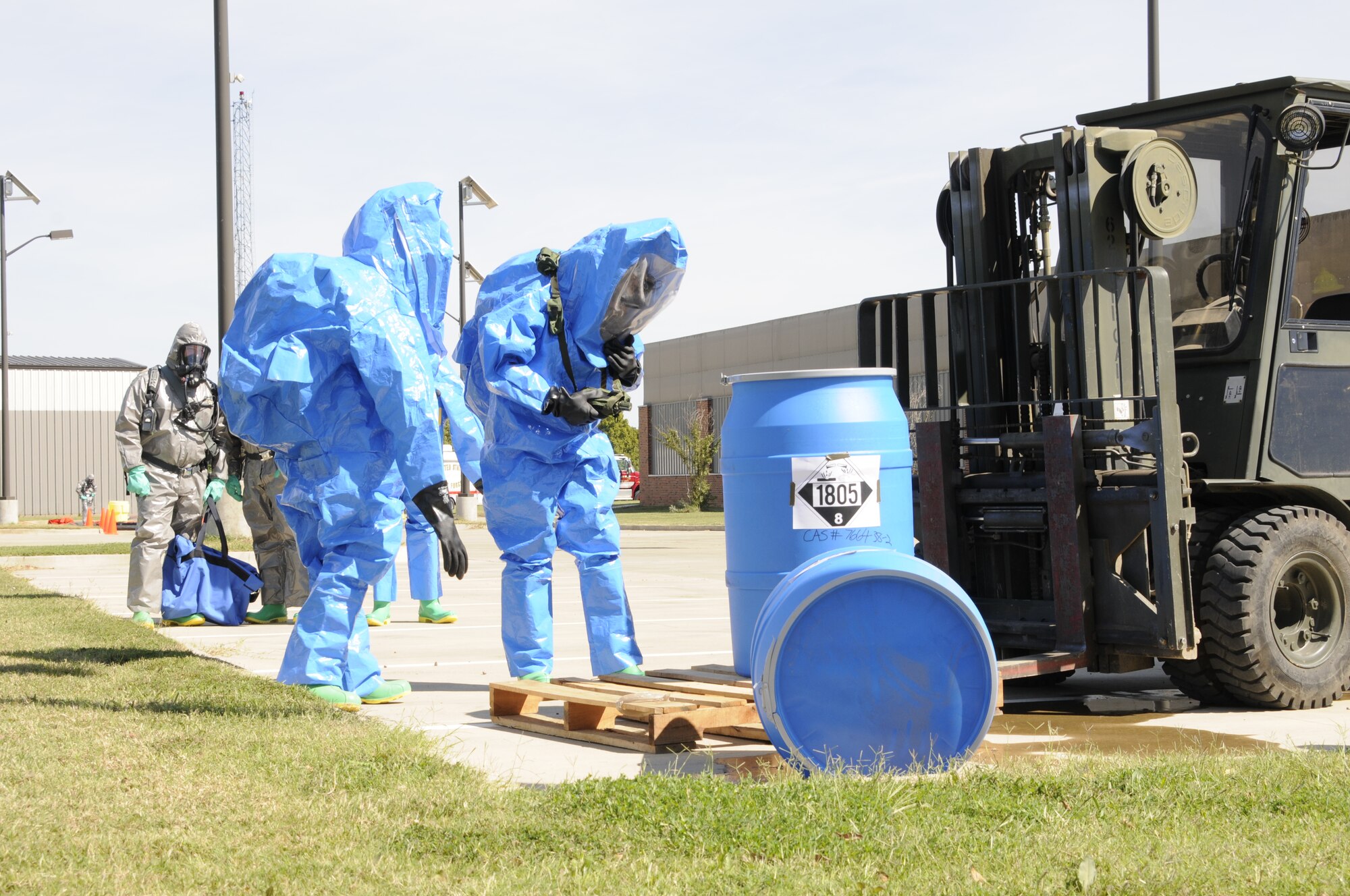 Emergency management specialists with the 188th Civil Engineering Squadron work to identify and clean up hazardous material spills during a training  exercise at Ebbing Air National Guard Base, Fort Smith, Ark., Oct. 4. (U.S. Air National Guard photo by Staff Sgt. Hannah Landeros/released)