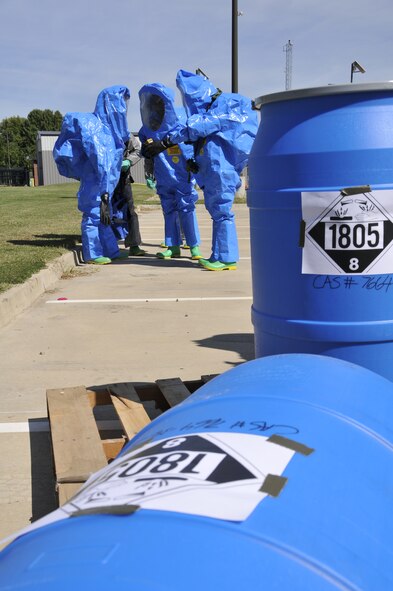 Emergency management specialists with the 188th Civil Engineering Squadron work to identify and clean up hazardous material spills during a training  exercise at Ebbing Air National Guard Base, Fort Smith, Ark., Oct. 4. (U.S. Air National Guard photo by Staff Sgt. John Suleski/released)