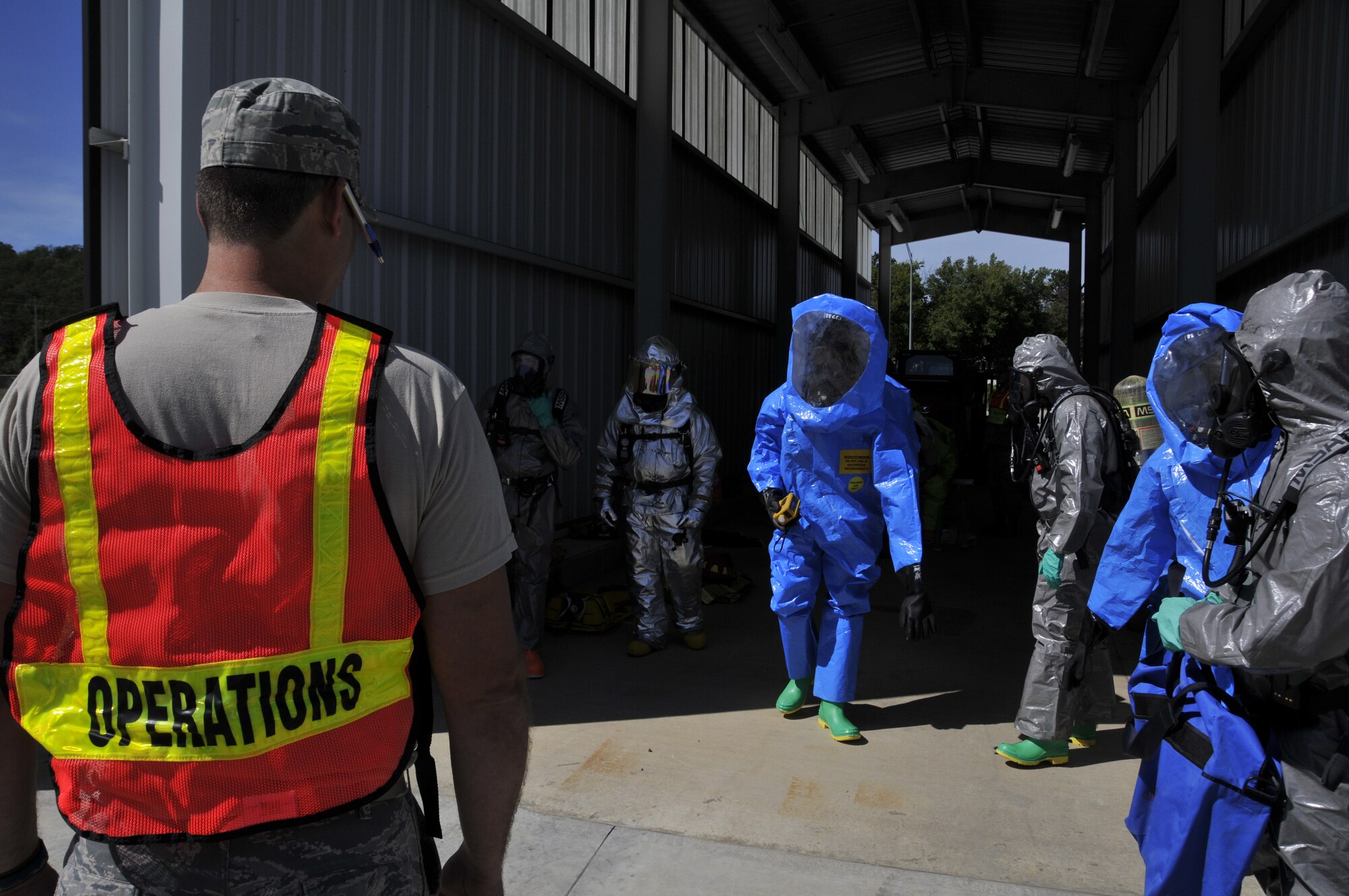 Emergency management specialists with the 188th Civil Engineering Squadron work to identify and clean up hazardous material spills during a training  exercise at Ebbing Air National Guard Base, Fort Smith, Ark., Oct. 4. (U.S. Air National Guard photo by Staff Sgt. John Suleski/released)