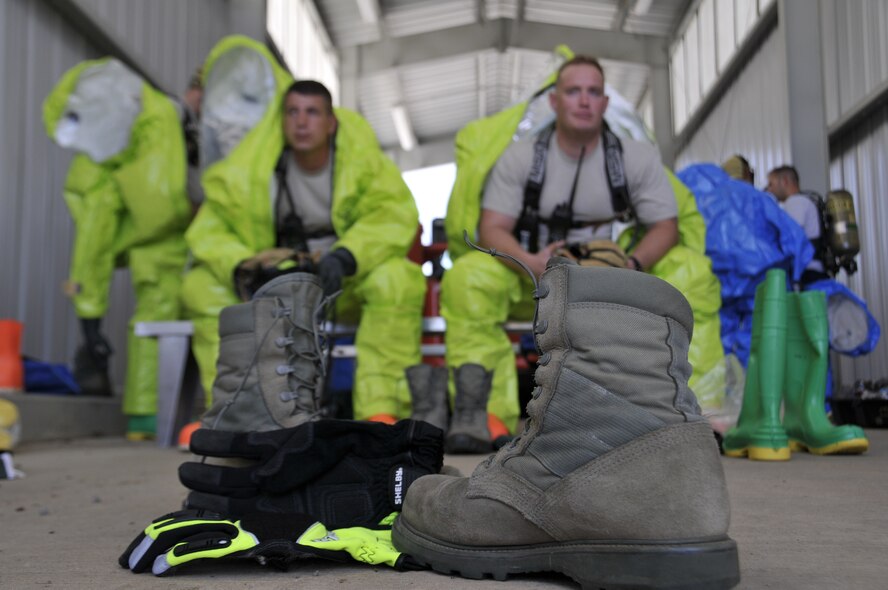 Emergency management specialists with the 188th Civil Engineering Squadron work to identify and clean up hazardous material spills during a training  exercise at Ebbing Air National Guard Base, Fort Smith, Ark., Oct. 4. (U.S. Air National Guard photo by Staff Sgt. John Suleski/released)