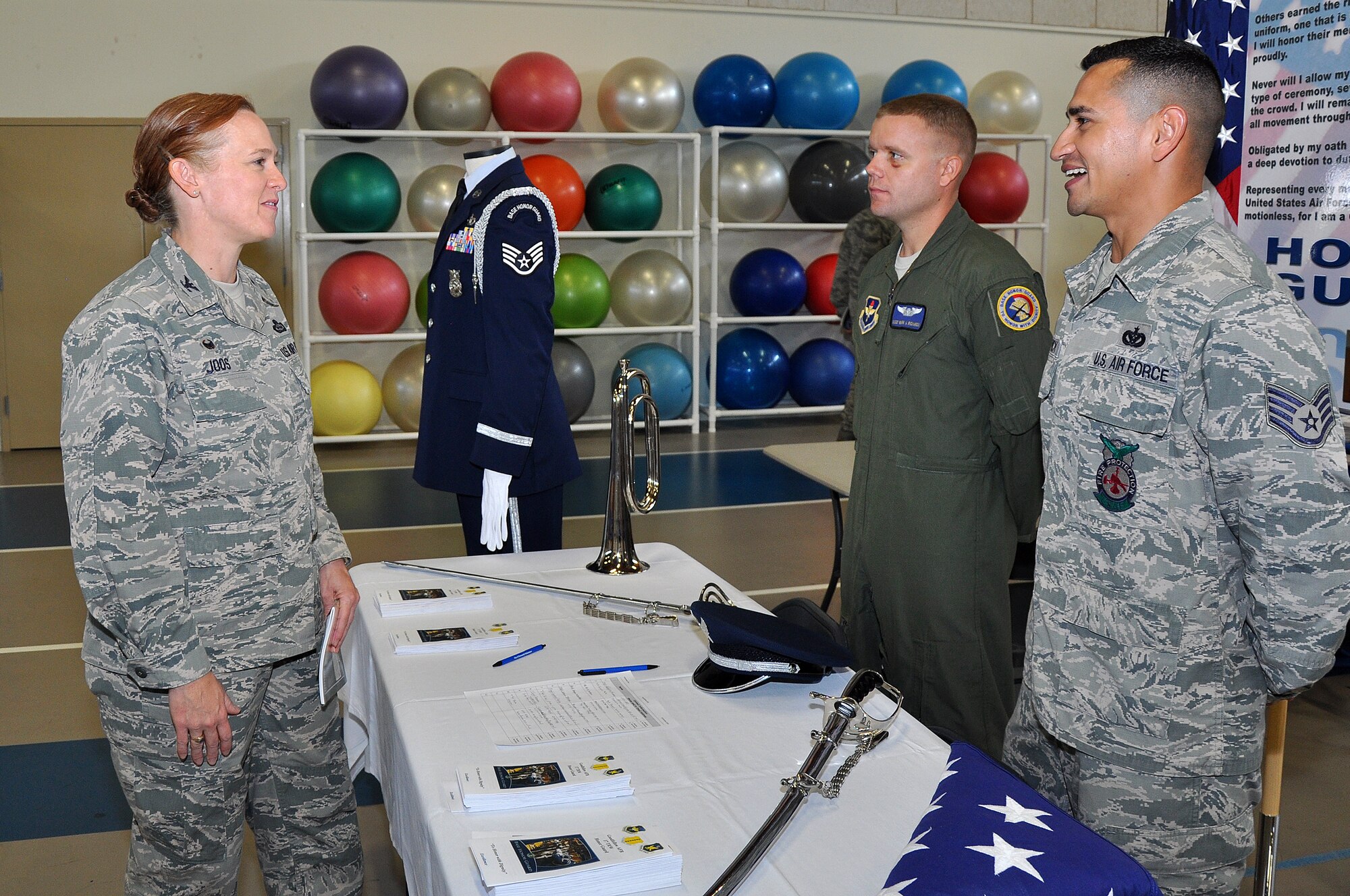 GOODFELLOW AIR FORCE BASE, Texas – Col. Kimberlee P. Joos, 17th Training Wing Commander, speaks with Staff Sgt. Mark A. Richards, 316th Training Squadron instructor, and Staff Sgt. Albert L. Hetrick, 312th Training Squadron instructor and 17th Force Support Squadron Honor Guard NCO in charge, during the Volunteer Fair at the Carswell Field House Oct. 30. The Honor Guard seeks active duty Airmen to support events and ceremonies in the region. (U.S. Air Force photo/ Airman 1st Class Devin Boyer)