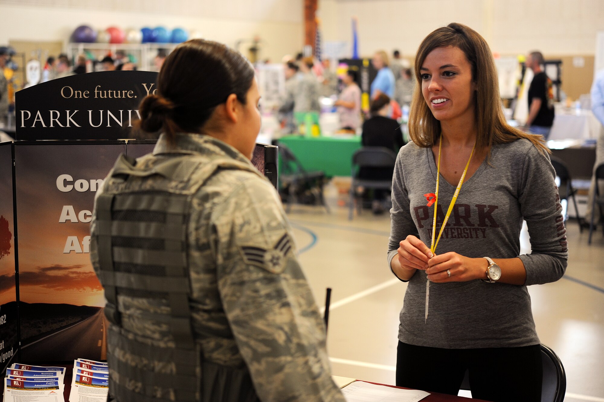 GOODFELLOW AIR FORCE BASE, Texas – Senior Airman Heather L. Cortes, 17th Security Forces Squadron patrolman, speaks with Emily K. Cornwell, Park University administrative assistant, during the Volunteer Fair at the Carswell Field House Oct. 30. At this year’s volunteer fair, the 17th Force Support Squadron and local colleges provided information about their organizations. (U.S. Air Force photo/ Airman 1st Class Devin Boyer)
