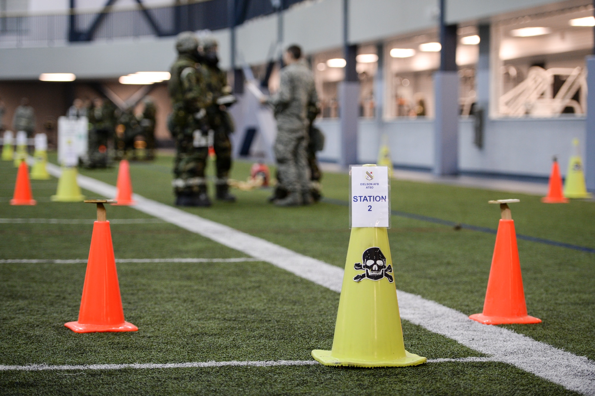 U.S. Airmen demonstrate their readiness capabilities through simulated phases of chemical attack and handling casualties Oct. 28, 2014, during ability to survive and operate (ATSO) training at Eielson Air Force Base, Alaska. ATSO cadres executed training in a new streamlined method to better handle large numbers of Airmen and make more efficient use of time. (U.S. Air Force photo by Senior Airman Peter Reft/Released)