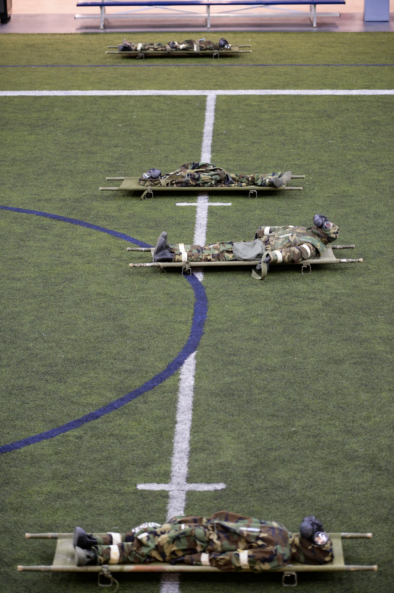 Simulated casualties wait for training scenarios Oct. 28, 2014,  during ability to survive and operate training at Eielson Air Force Base, Alaska. The Field House enabled cadres to lead multiple teams of Airmen through different scenarios at the same time. (U.S. Air Force photo by Senior Airman Peter Reft/Released)