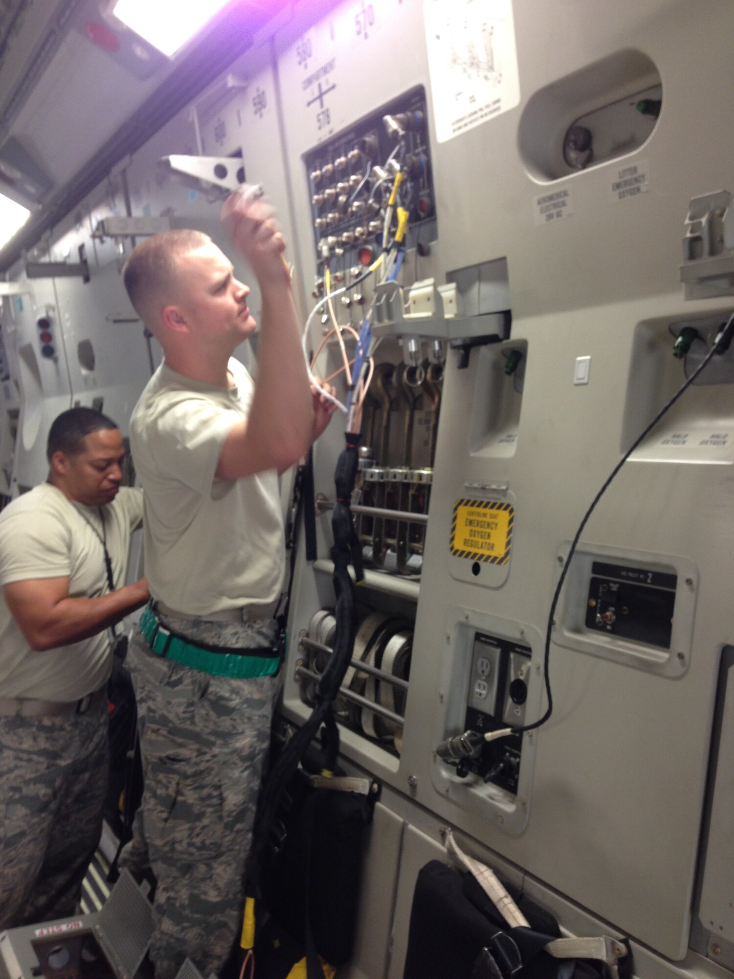 Maintainers from McChord Air Force Base's 62nd Airlift Wing work on a C-17 Globemaster. The maintainers were at Kirtland to support the 57th Weapons Squadron's intense four-week Composite Mission Application phase training, part of the U.S. Air Force Weapons School curriculum. Six students tackled eight flying missions. (Photo by Capt. Timothy Goodwillie)