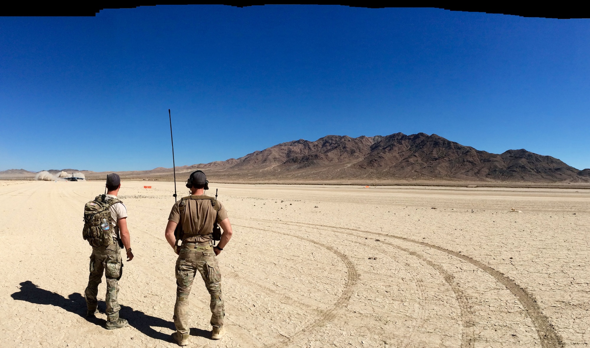 Members of the 22nd Special Tactics Squadron out of McChord AFB, Wash., watch the landing of a C-17 in a dry lake bed. The Airmen were at Kirtland in support of the  57th Weapons Squadron's four-week Composite Mission Application phase training, part of the U.S. Air Force Weapons School curriculum. Six students tackled eight flying missions, including landing the aircraft in austere conditions. (Courtesy photo)