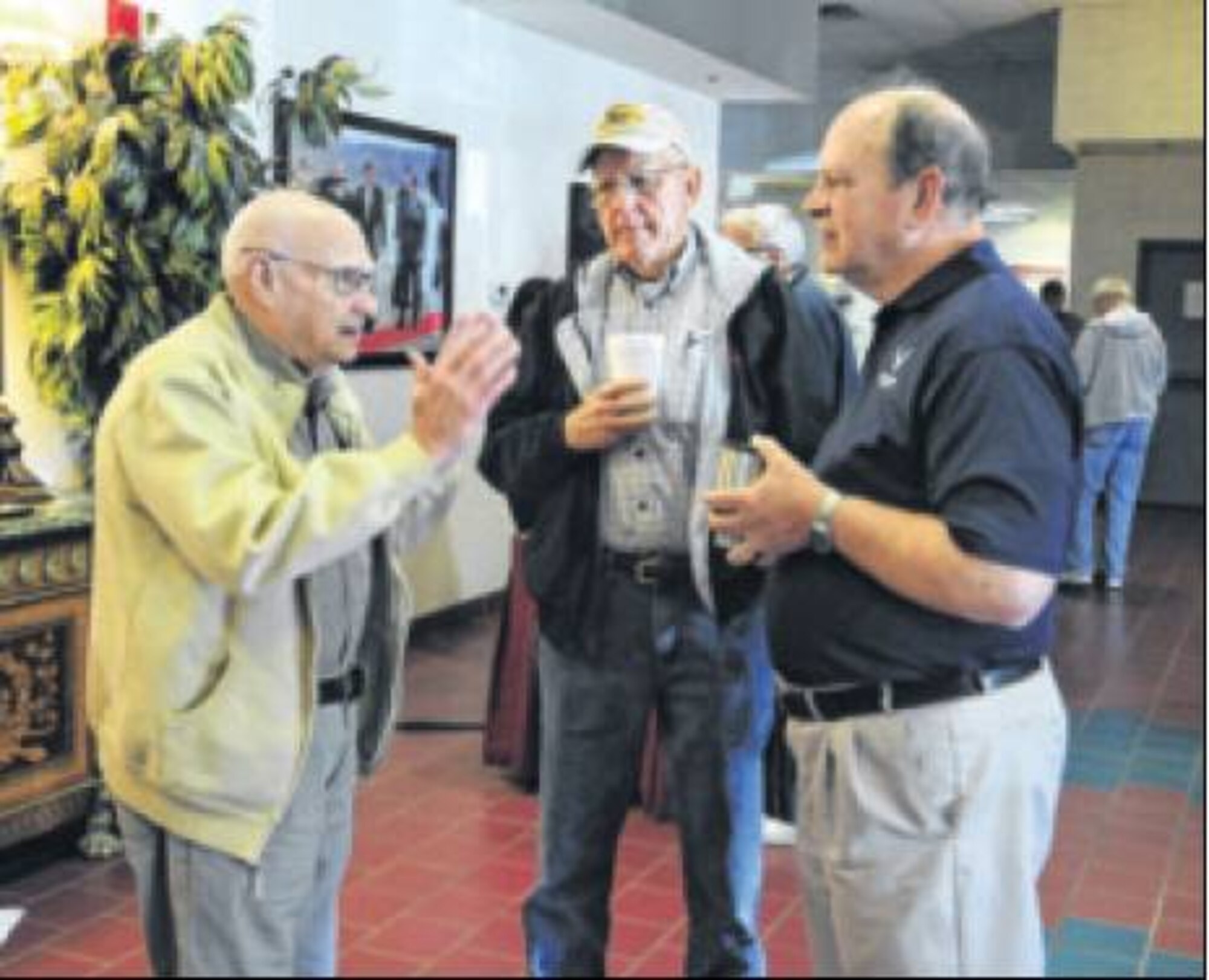 (Left to right) Larry Sonnenverg, Earl Beach and Bob Anderl, Air Force retirees, reminisce about their military service while attending Retiree Appreciation Day at the Hope Hotel on Oct. 24.