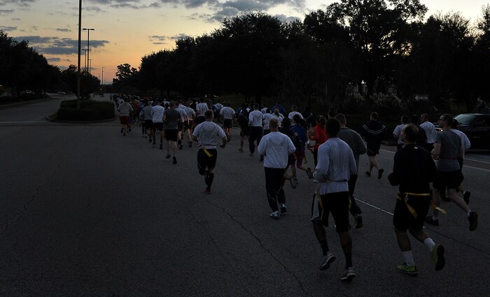 Members of Joint Base Charleston run in the Combined Federal Campaign Zombie Run fundraiser Oct. 31, 2014, at JB Charleston, S.C. The 1.7 mile run forced runners to dodge zombies in three "contaminated" areas in order to "survive." (U.S. Air Force photo/Staff Sgt. Renae Pittman)