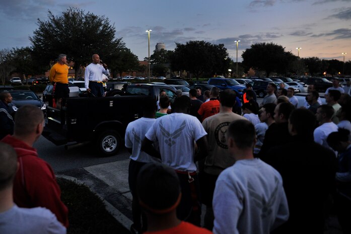 U.S. Navy Capt. Timothy Sparks, Joint Base Charleston deputy commander, and Col. Jimmy Canlas, 437th Airlift Wing vice commander, welcome runners to the start of the JB Charleston Combined Federal Campaign Zombie Run Oct. 31, 2014, at JB Charleston, S.C. The 1.7 mile run, a Combined Federal Campaign fund raiser, forced runners to dodge zombies in three "contaminated" areas in order to "survive." (U.S. Air Force photo/Staff Sgt. Renae Pittman)