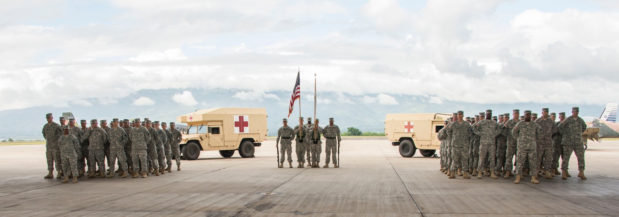 Two U.S. Army companies stand in formation for Joint Task Force-Bravo’s Medical Element Transfer of Authority Ceremony between the 228th Combat Support Hospital and the 94th Combat Support Hospital on Soto Cano Air Base, Honduras, Oct. 31, 2014.  Over the past two weeks the 228th CSH prepared the 94th CSH to take over their U.S. Southern Command mission.  The JTF-B MEDEL is the only forward deployed medical asset with and enduring presence within SOUTHCOM.  MEDEL provides medical support to DoD beneficiaries in garrison at Soto Cano AB, as well as supporting SOUTHCOM’s humanitarian assistance and disaster relief efforts.  (U.S. Air Force photo/Tech. Sgt. Heather Redman)