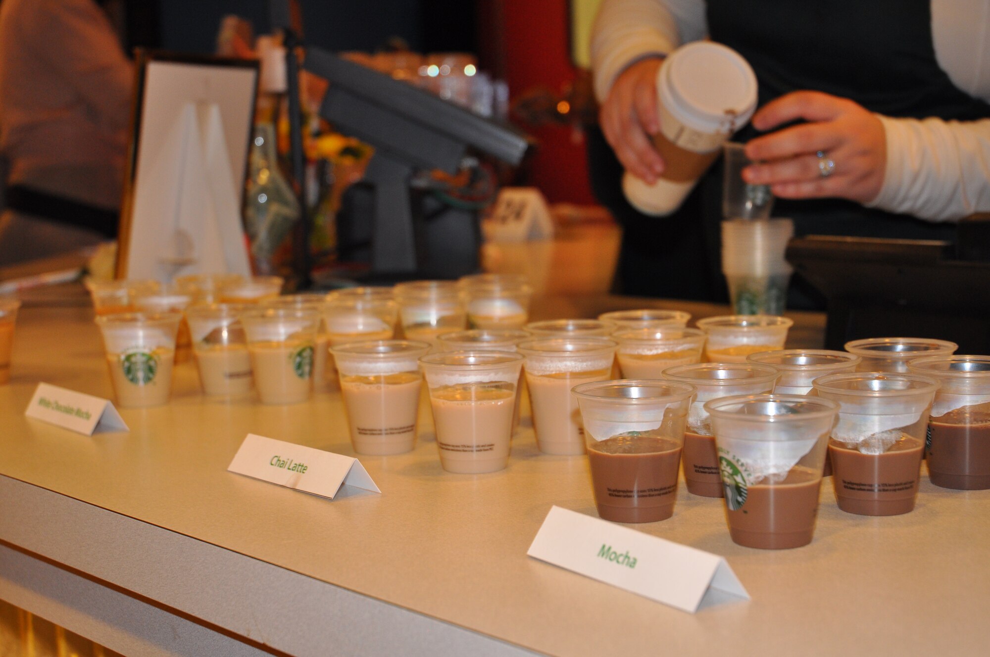 Samples of popular coffee drinks are offered at the grand opening of the base café Oct. 27, 2014, at J.R. Rockers on Grand Forks Air Force Base, N.D. By popular request, J.R. Rockers now serves name-brand coffee beverages. Renovations to J.R. Rockers also included redesigning the game room into a sit-down café. (Courtesy photo)