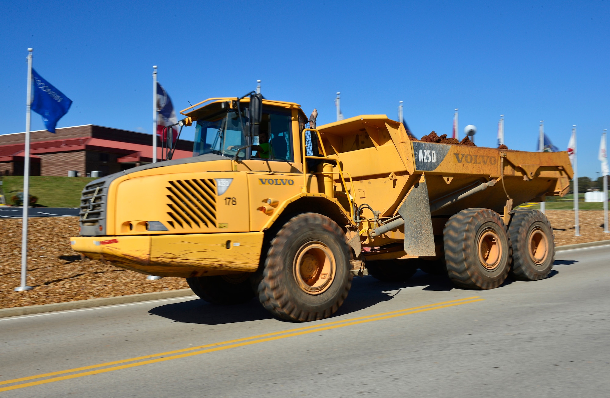 MCGHEE TYSON AIR NATIONAL GUARD BASE, Tenn. - A construction worker transports a load of excavated dirt here Oct. 30, 2014, from the construction site for the new facility at the I.G. Brown Training and Education Center. This load is just a small portion of the estimated 7,000 cubic yards of projected soil movement. The dirt is being stored on base for use in future building projects. (U.S. Air National Guard photo by Master Sgt. Jerry D. Harlan/Released)