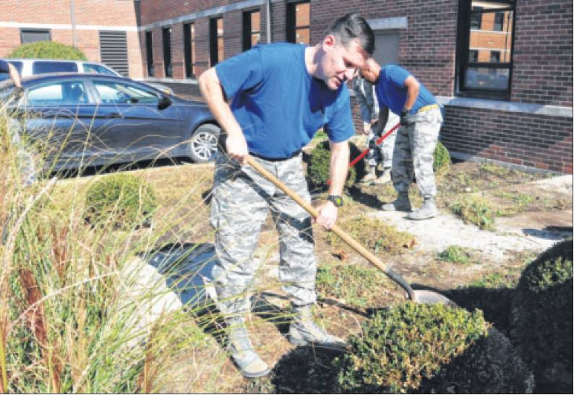 Col. John Devillier, 88th Air Base Wing commander, worked alongside volunteers to improve the grounds around the 88th Air Base Wing headquarters building. (Air Force photos by Diane Kofoed) 


