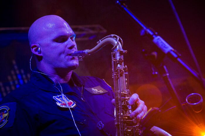 Master Sgt. Jeffrey Saunders, a saxophonist with the U.S. Air Force Heritage of America Band, performs in front of hundreds of West Ashley high school students Oct. 29, 2014, at West Ashley High School in Charleston, S.C. Full Spectrum, a high energy band that features a horn section, is one of the newest ensembles in the Air Force’s Heritage of America Band. This group of dynamic musicians performs a 'full spectrum' of music - ranging from Pop, Hip Hop, Funk, R&B, Latin and Classic Rock. (U.S. Air Force photo/Airman 1st Class Clayton Cupit)