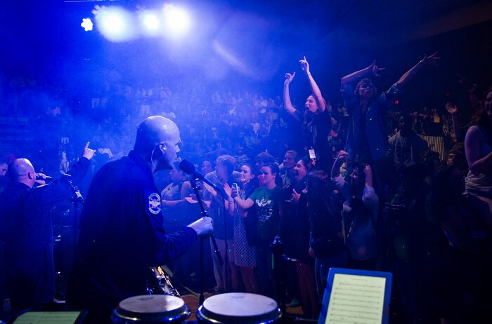 Master Sgt. Jeffrey Saunders, a saxophonist with the U.S. Air Force Heritage of America Band, sings along with other band members Oct. 29, 2014, at West Ashley High School in Charleston, S.C. Full Spectrum, a high energy band that features a horn section, is one of the newest ensembles in the Air Force’s Heritage of America Band. This group of dynamic musicians performs a 'full spectrum' of music - ranging from Pop, Hip Hop, Funk, R&B, Latin and Classic Rock. (U.S. Air Force photo/Airman 1st Class Clayton Cupit)