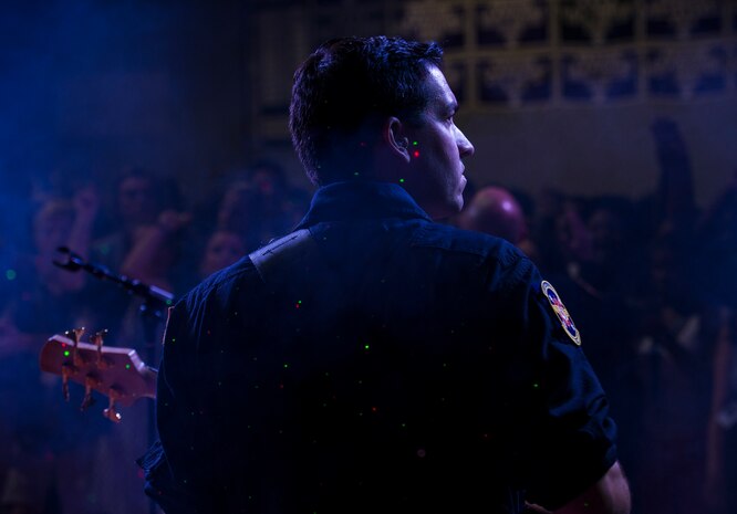 Staff Sgt. Jordan Kimble, a bassist with the U.S. Air Force Heritage of America Band Full Spectrum, performs in front of hundreds of West Ashley high school students Oct. 29, 2014, at West Ashley High School in Charleston, S.C. Featuring members with vast musical knowledge and extensive performance resumes, Full Spectrum was created for an Air Force Heritage of America Band deployment to Southwest Asia in May 2013. After months performing in forward operating environments for U.S. and coalition troops and building International partnerships, they are now bringing their deployed experiences to audiences up and down the East Coast from South Carolina to Maine. (U.S. Air Force photo/Airman 1st Class Clayton Cupit)