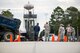 Airmen from the 23d Civil Engineer Squadron pour gravel into a hole Oct. 30, 2014, at Moody Air Force Base, Ga. Prior to pouring the new concrete, the Airmen first had to lay down a foundation to ensure the pavement would settle correctly. (U.S. Air Force photo by Airman 1st Class Ryan Callaghan/Released)