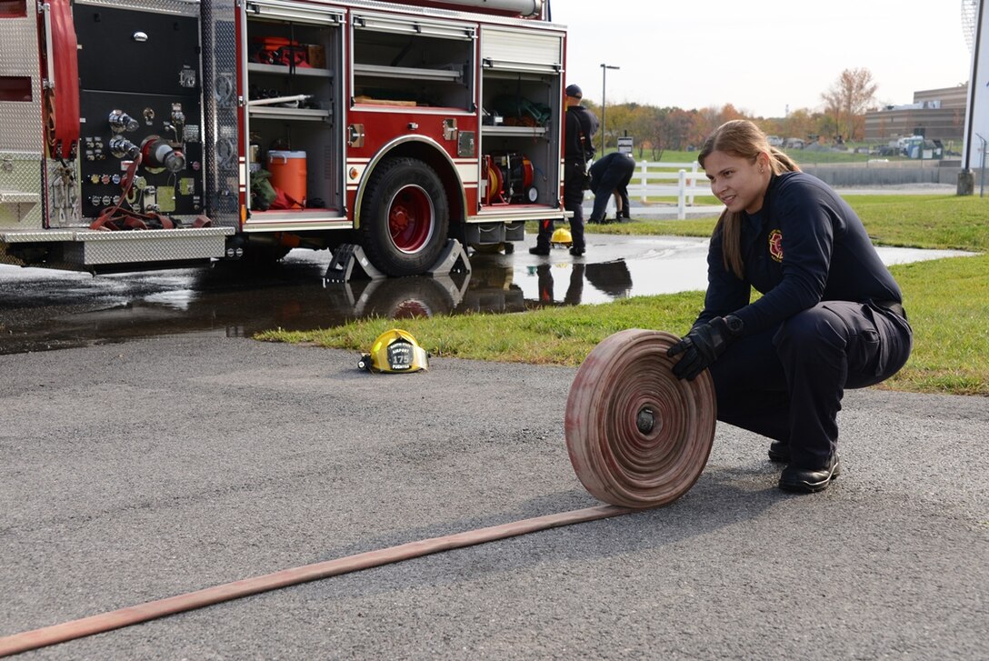 Senior Airman Sheila M. Fuentes is a full-time firefighter at Warfield Air National Guard Base; she left her unit and home in Puerto Rico to pursue a career in firefighting in the Maryland Air National Guard. (U.S. Air National Guard photo by Senior Master Sgt. Ed Bard/RELEASED)