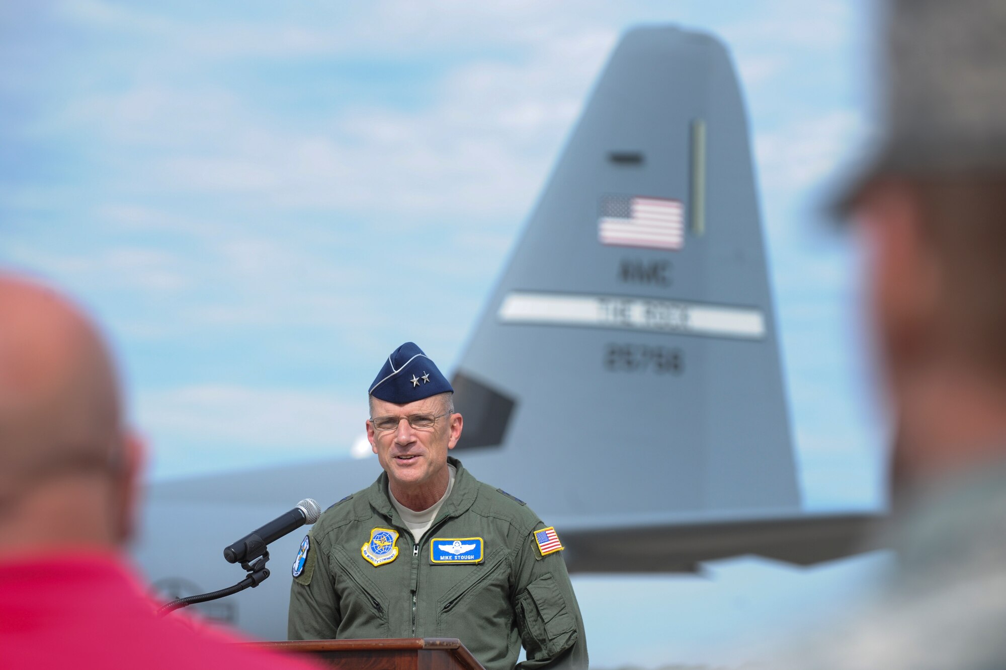 Maj. Gen. Mike Stough, Headquarters Air Mobility Command director of strategic plans, requirements and programs, speaks to a crowd after delivering a new C-130J to Little Rock Air Force Base, Ark, Oct. 23, 2014. The delivery of this aircraft marks the ninth C-130J to be delivered to the 61st Airlift Squadron. (U.S. Air Force photo by Airman 1st Class Cliffton Dolezal)