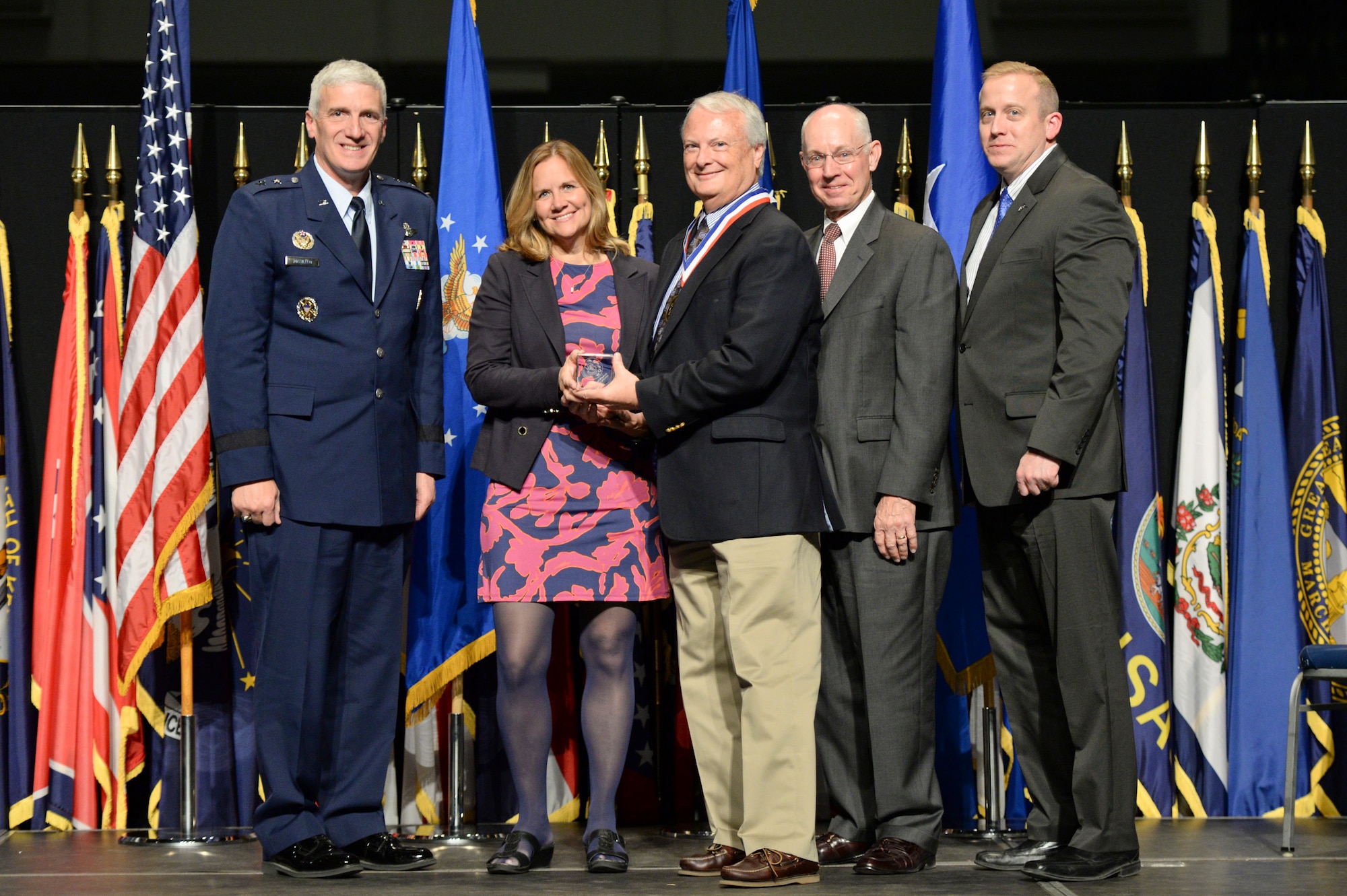 Mr. Paul Kervin, senior research physicist, Air Force Research Laboratory Directed Energy Directorate, and his wife Grace, are honored during the AFRL Fellows and Early Career Awards Banquet, Oct. 30 at the National Museum of the U.S. Air Force. Joining them are Maj. Gen. Tom Masiello, AFRL commander, retired Maj. Gen. Dick Paul, AFRL's first commander, and Dr. Morley Stone, AFRL chief technology officer. (U.S. Air Force photo/Wesley Farnsworth)