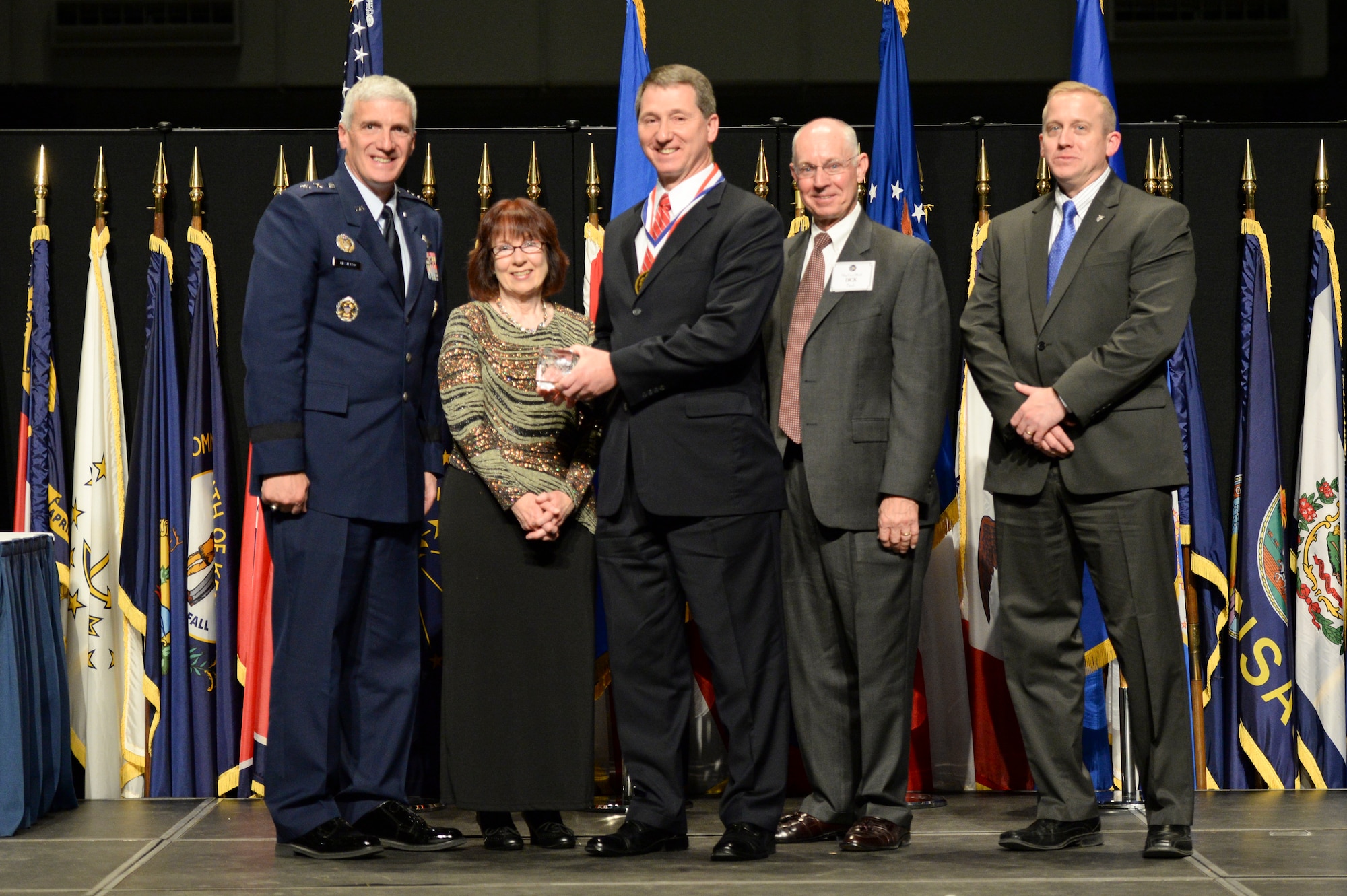Dr. Paul Antonik, Air Force senior scientist for connectivity and dissemination, Air Force Research Laboratory's Information Directorate and his wife Cathy are honored during the 2014 AFRL Fellows and Early Career Awards Banquet, held Oct. 30 at the National Museum of the U.S. Air Force. Joining them are Maj. Gen Tom Masiello, AFRL commander, retired Maj. Gen. Dick Paul, AFRL's first commander, and Dr. Morley Stone, AFRL chief technology officer.  (U.S. Air Force photo/Wesley Farnsworth)